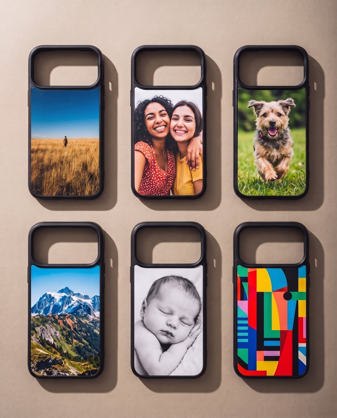Six Kase Artist cases laid out in two rows, each printed with a different photograph: a walker in golden grass, two friends, a running dog, a mountain range, a sleeping baby and a bright abstract pattern